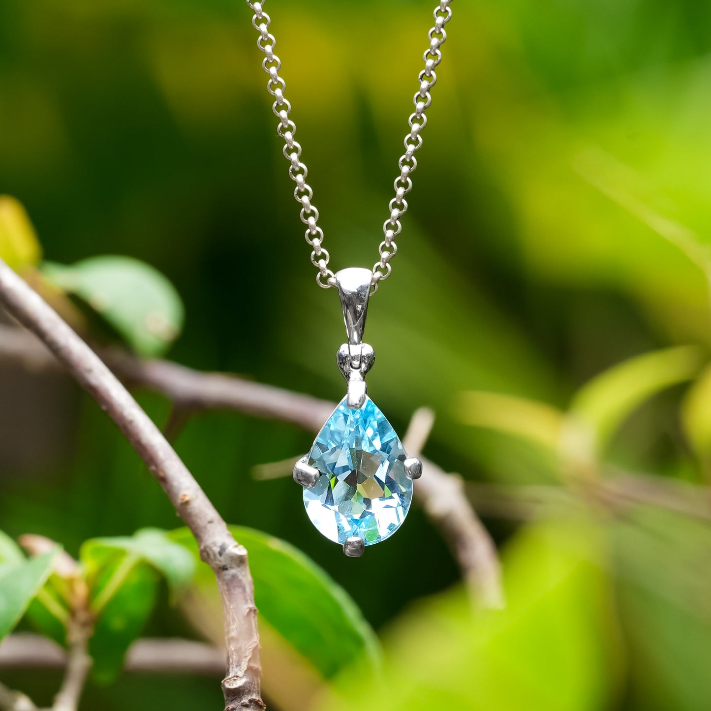 Starborn Blue Topaz Pear-Shape Pendant in Fine Sterling Silver